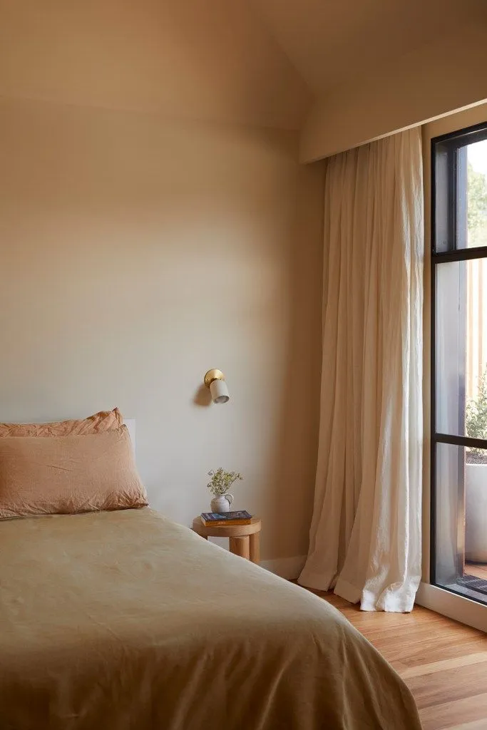 Placeholder — bedroom in warm clay tones