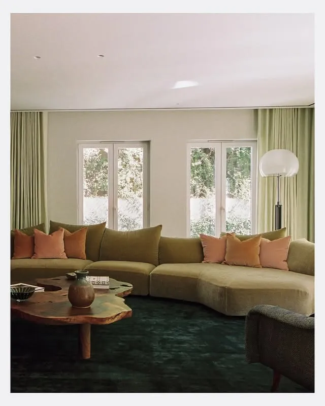 Placeholder — living room with an olive sofa